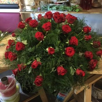 coussin rond de roses rouges